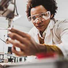 Woman checking manufacturing quality of product